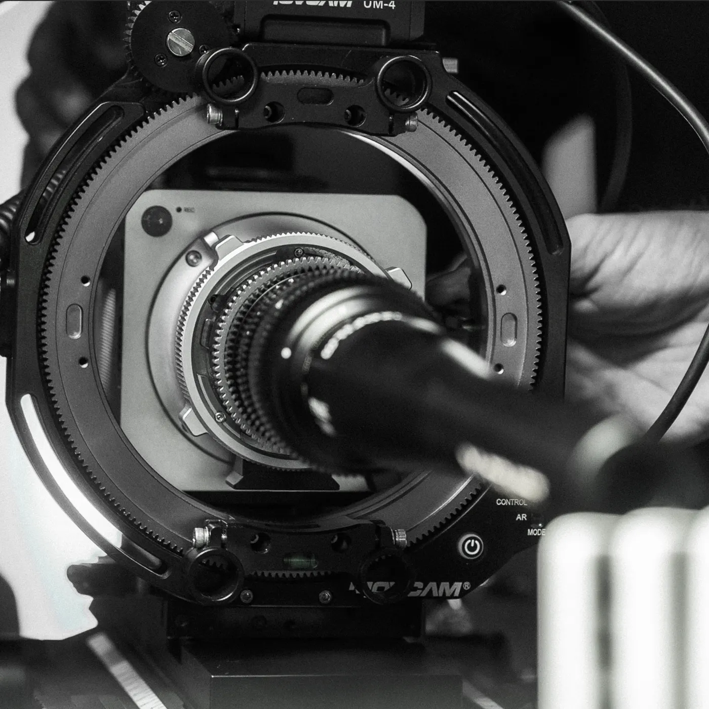 Close-up of a follow-focus and matte box rig around a Spark camera